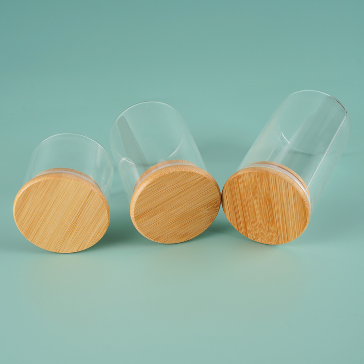 Tarro de vidrio del tanque de almacenamiento de alimentos con logotipo personalizado transparente ecológico de 100 g, 120 g, 150 g con cubierta de bambú y madera