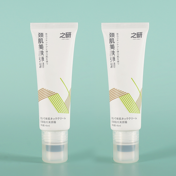 Tubo de envase de plástico cosmético con cabezal aplicador flocado